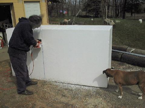 David cutting foam with Bonnie Boxer looking on.