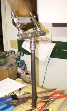 Beginning of the perch . Perch will rotate 45 degrees left and right of center. The two stubby pipes are the parrots legs and the metal between them is the main body mount. The body will pivot on two sintered bronze bearings that will support the entire weight of the bird.